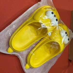 Source Unknown Yellow Cartoon Slippers